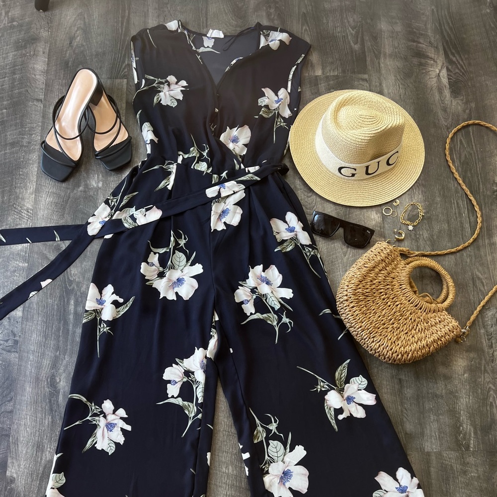 Navy blue Floral Romper other items in the picture not included.